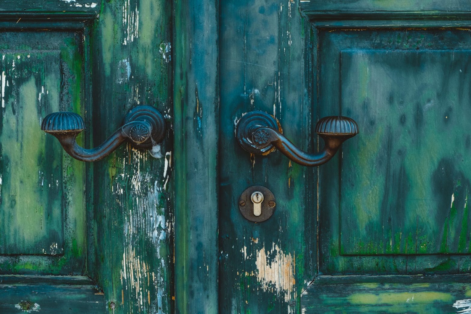 black and green door with black door knob